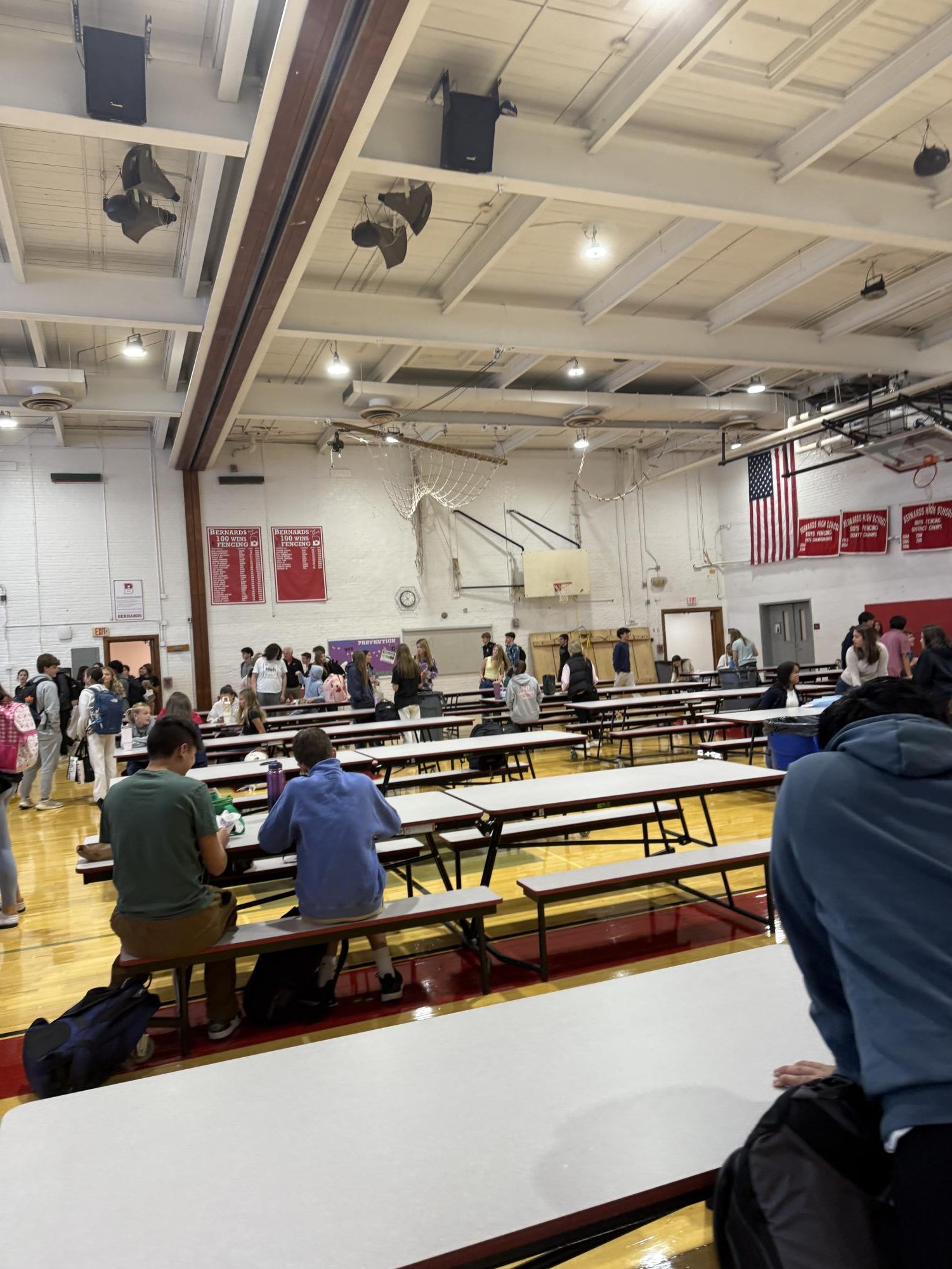 Students filing into one of the designated lunch spots, the upper gym.