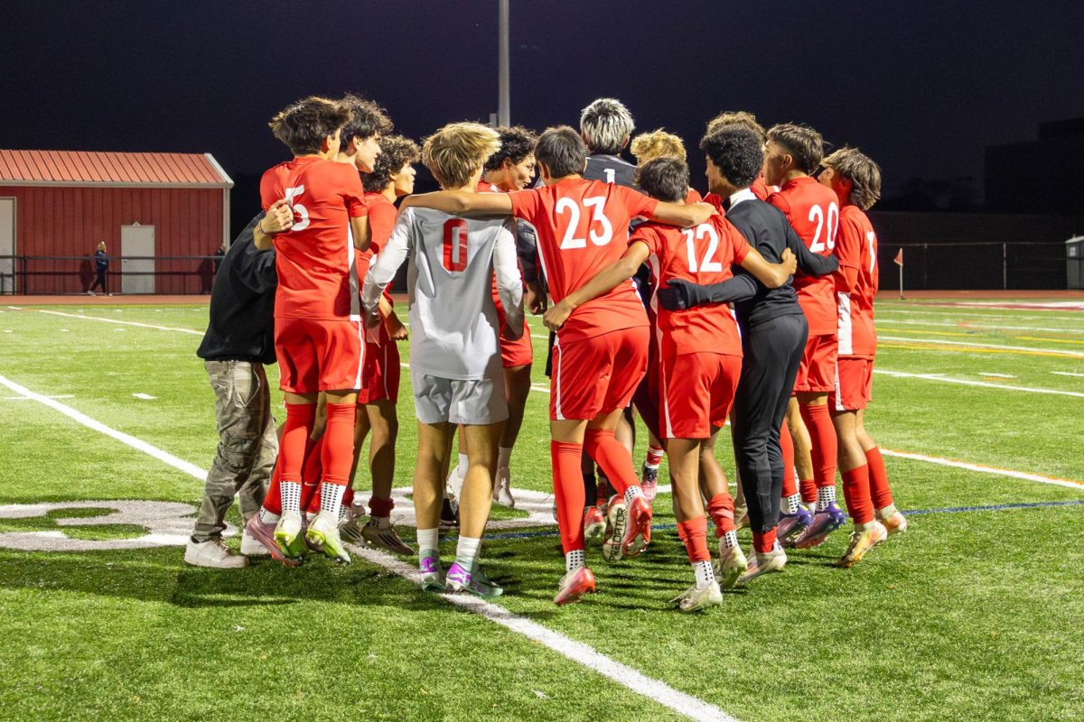 The boys soccer team celebrates after a win during the 2025 season.