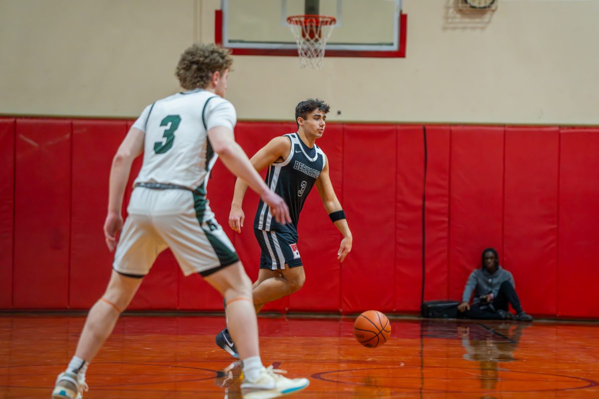 Zach Marto '26 dribbles up the court
