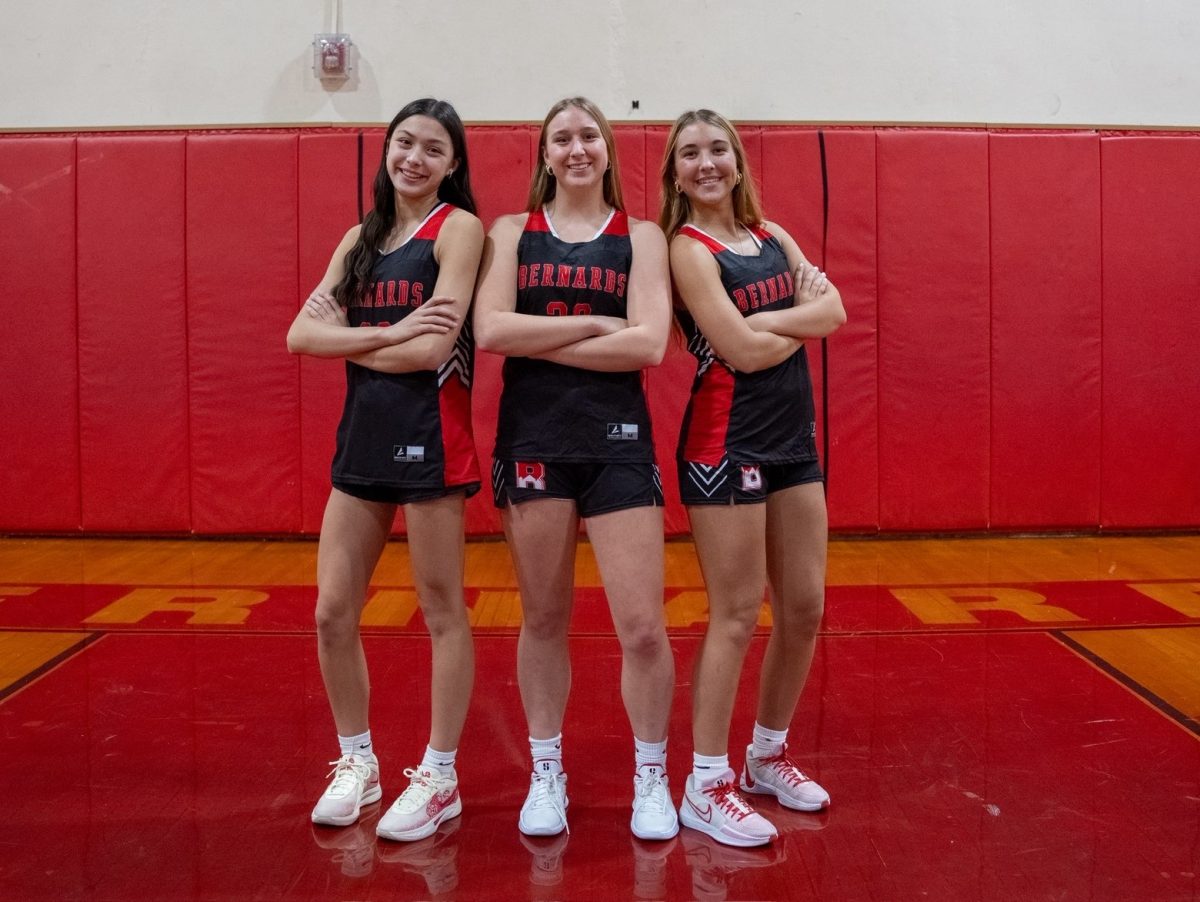 Jasmine Kelleher '27, Aletha Reynolds '26, and Maddie Frame '27 pose for a picture