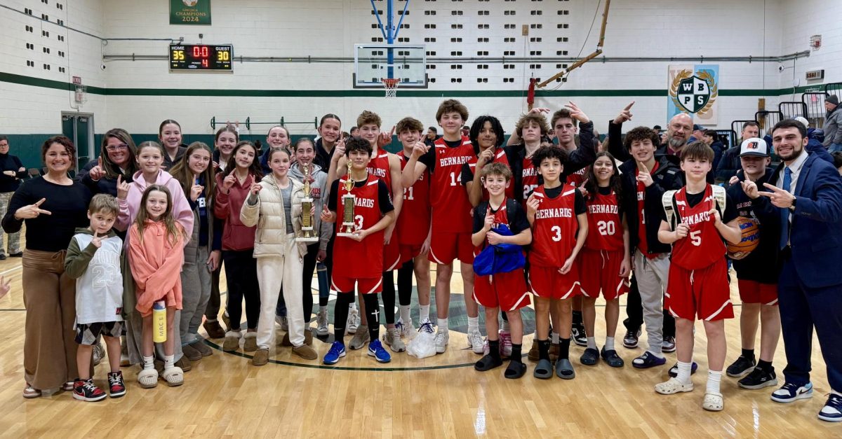 The Girls and Boys team's pose for a photo following their respective championship wins