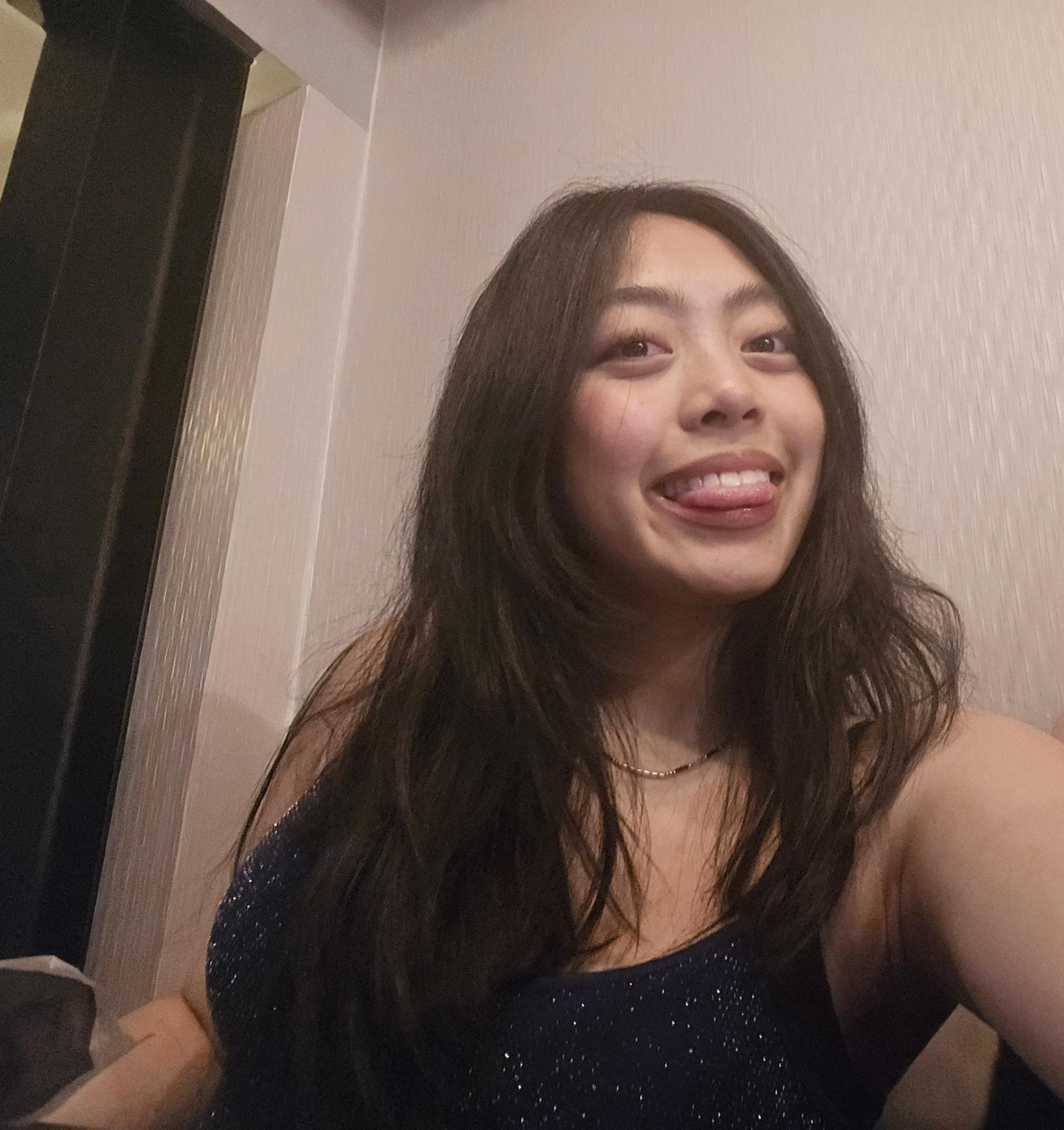 Eva smiles for a selfie photo backstage during a rehearsal 