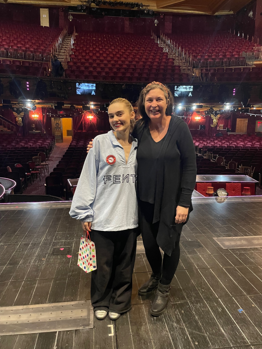Meg Donnelly and her old teacher, Ms. Brooten, pose for a picture backstage at Moulin Rouge