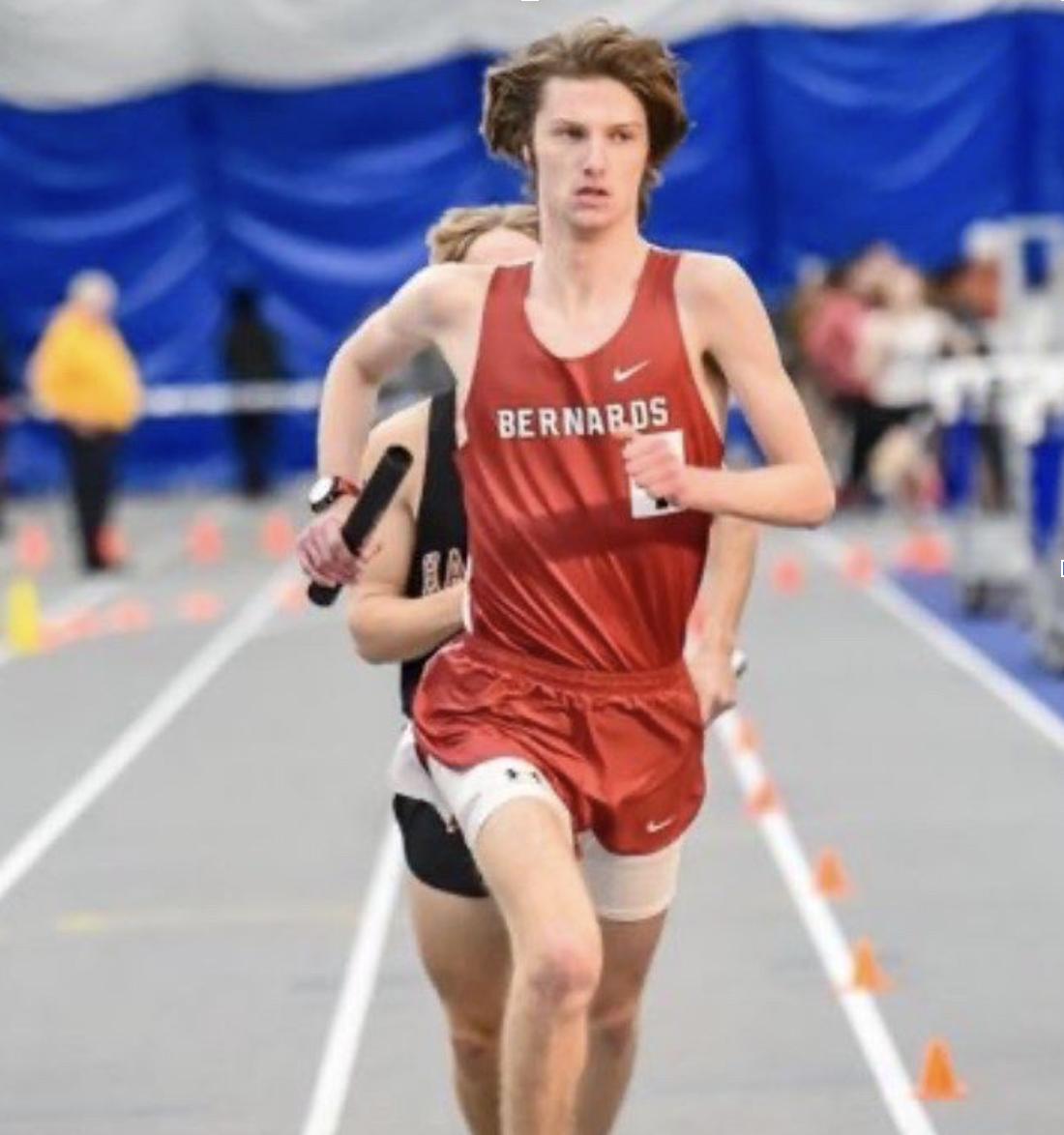 Brody Watt '26, strides with the baton and stays ahead of the competition