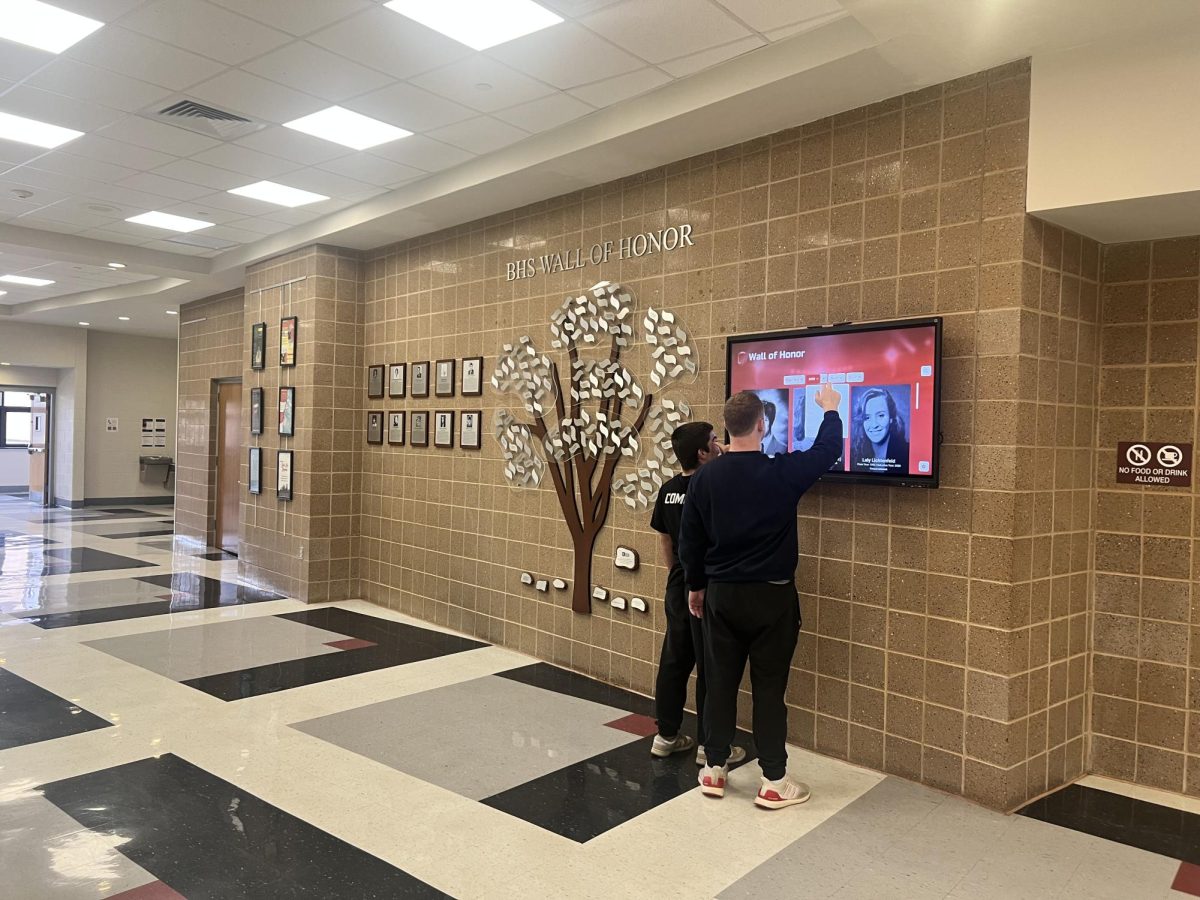 Students interacting with the new digital touchscreen archive honoring BHS alumni