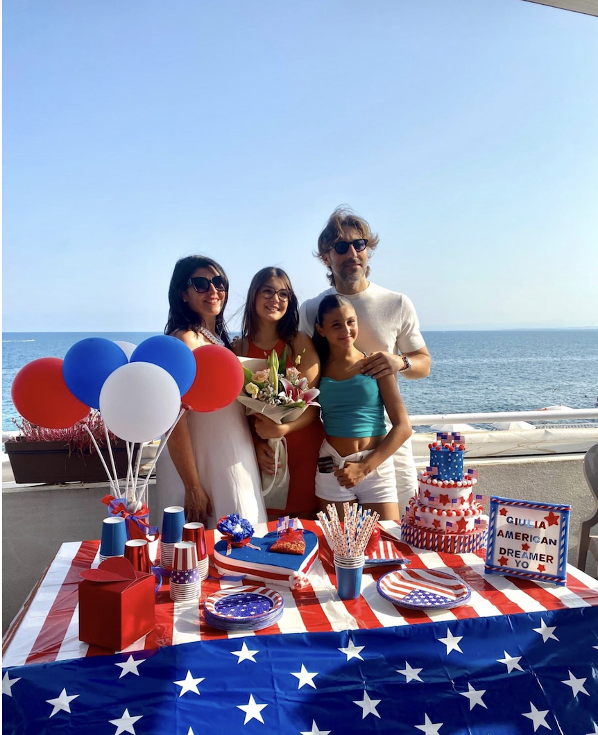 Giulia poses with her family at her going away party 